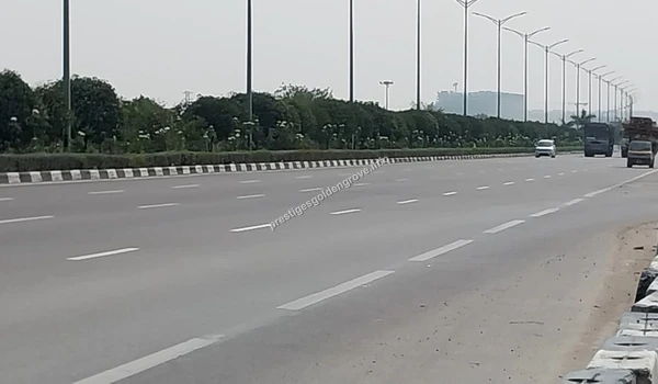 Expressway Infrastructure Wide view of the high-speed expressway lanes near Kollur, showcasing the modern infrastructure and fast commute options from Prestige Golden Grove