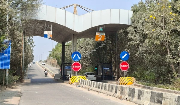 Smooth Commute Access Wide, modern road infrastructure featuring a FASTag-enabled toll gate, highlighting the quick and traffic-free commuting options around the Prestige Golden Grove area