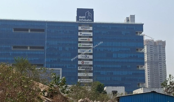 GAR Infobahn Nearby View of the prominent GAR Infobahn IT park featuring major corporate offices like Amazon and Capgemini, located in close proximity to the Prestige Golden Grove project site