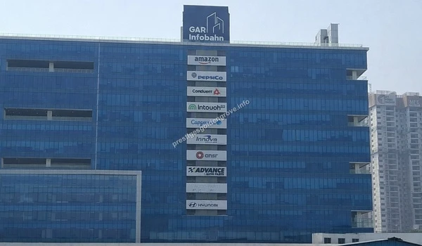 Major Corporate Hub External facade of the GAR Infobahn complex housing multinational corporations like PepsiCo and Hyundai, highlighting the prime business locality near the Prestige Golden Grove site