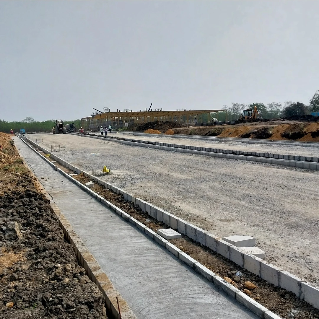 Road Development Panoramic view of ongoing road development and extensive land grading work at the Prestige Golden Grove construction site