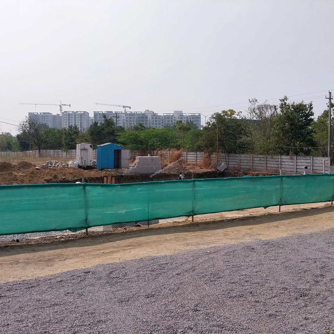Site Preparations Temporary site offices and initial groundwork visible behind the green safety fencing at the Prestige Golden Grove project area
