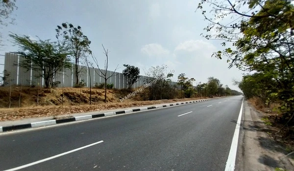 Prestige Kollur Road Access Wide road view showing the seamless access to Prestige Golden Grove and the surrounding Prestige Kollur development area